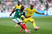 MEXICO CITY, MEXICO - JUNE 11: Julian Quinones #16 of Mexico is challenged by Jayden Adams #23 of South Africa during the FIFA World Cup 2026 Group A match between Mexico and South Africa at Mexico City Stadium on June 11, 2026 in Mexico City, Mexico. (Photo by Luke Hales/Getty Images)