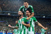 SEVILLE, SPAIN - OCTOBER 14: Isco of Real Betis celebrates after scoring his team's third goal with Marc Bartra and Dani Ceballos during the UEFA Champions League 2026/27 League Phase MD2 match between Real Betis Balompie and FC Porto at Estadio de La Cartuja on October 14, 2026 in Seville, Spain. (Photo by Angel Martinez/Getty Images)