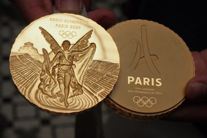 Model of the gold medals that will be used in the Olympic Games Paris 2024 is presented at the 130th session of the International Olympic Committee which is being held in Lima.