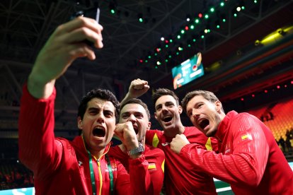 BOLOGNA, ITALY - NOVEMBER 22: Jaume Munar, Pablo Carreno Busta, Pedro Martinez and Marcel Granollers of Spain celebrate after winning the Davis Cup Semi-Final match between Spain and Germany at BolognaFiere Exhibition Centre on November 22, 2025 in Bologna, Italy. (Photo by Clive Brunskill/Getty Images for ITF)