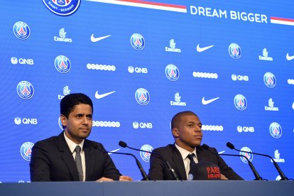 PARIS, FRANCE - SEPTEMBER 06:  (L-R) Paris Saint-Germain President Nasser Al Khelaifi and new signing Kylian Mbappe speak to the media during a press conference at the Parc des Princes on September 6, 2017 in Paris, France. Kylian Mbappe signed a five year contract for 180 Million Euro.  (Photo by Aurelien Meunier/Getty Images)