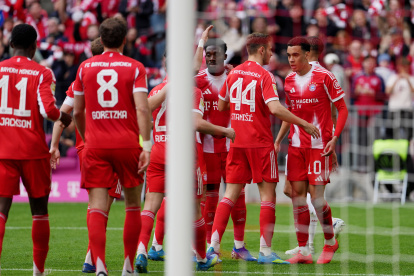 MUNICH, GERMANY - APRIL 19: Raphael Guerreiro of FC Bayern Munich celebrates scoring his team's first goal with teammates during the Bundesliga match between FC Bayern München and VfB Stuttgart at Allianz Arena on April 19, 2026 in Munich, Germany. (Photo by Leonhard Simon/Getty Images)