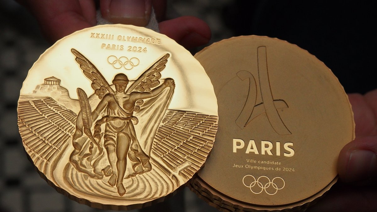 Model of the gold medals that will be used in the Olympic Games Paris 2024 is presented at the 130th session of the International Olympic Committee which is being held in Lima.