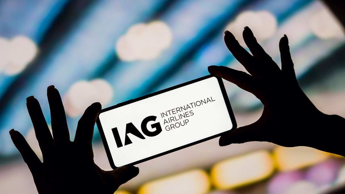 In this photo illustration, the International Airlines Group (IAG) logo is displayed on a smartphone screen.