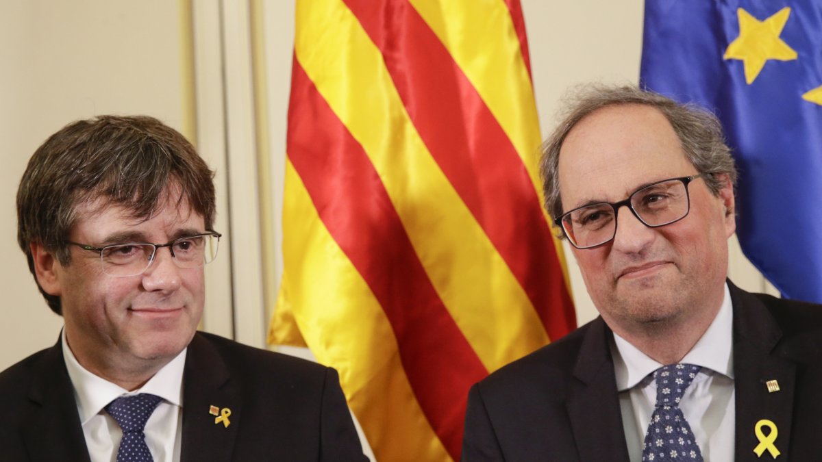 Carles Puigdemont y Quim Torra en una foto de 2019 cuando eran compañeros de Junts.