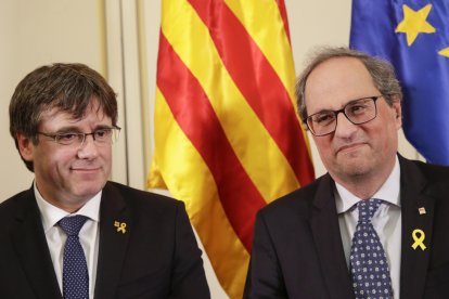 Carles Puigdemont y Quim Torra en una foto de 2019 cuando eran compañeros de Junts.