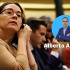 Una diputada se pone el pinganillo durante una sesión en el Congreso de los Diputados.