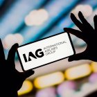 In this photo illustration, the International Airlines Group (IAG) logo is displayed on a smartphone screen.