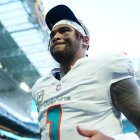 MIAMI GARDENS, FLORIDA - NOVEMBER 09: Tua Tagovailoa #1 of the Miami Dolphins runs off the field after defeating the Buffalo Bills 30-13 in the game at Hard Rock Stadium on November 09, 2025 in Miami Gardens, Florida. (Photo by Rich Storry/Getty Images)