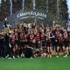 LIMA, PERU - NOVEMBER 29: Giorgian de Arrascaeta and Bruno Henrique of Flamengo lift the Champion's trophy after winning the the 2025 Copa CONMEBOL Libertadores Final match between Palmeiras and Flamengo at Estadio Monumental on November 29, 2025 in Lima, Peru.  (Photo by Buda Mendes/Getty Images)