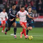 GIRONA, SPAIN - NOVEMBER 30: Ivan Martin of Girona is challenged by Jude Bellingham of Real Madrid during the LaLiga EA Sports match between Girona FC and Real Madrid CF at Montilivi Stadium on November 30, 2025 in Girona, Spain. (Photo by David Ramos/Getty Images)