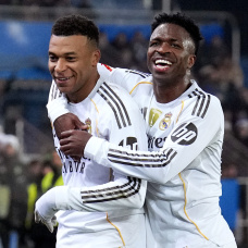 VITORIA-GASTEIZ, SPAIN - DECEMBER 14: Kylian Mbappe of Real Madrid celebrates scoring his team's first goal with teammate Vinicius Junior during the LaLiga EA Sports match between Deportivo Alaves and Real Madrid CF at Estadio de Mendizorroza on December 14, 2025 in Vitoria-Gasteiz, Spain. (Photo by Juan Manuel Serrano Arce/Getty Images)