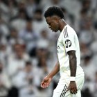 MADRID, SPAIN - DECEMBER 20: Vinicius Junior of Real Madrid walks off the pitch to be substituted for Gonzalo Garcia (not pictured) during the LaLiga EA Sports match between Real Madrid CF and Sevilla FC at Estadio Santiago Bernabeu on December 20, 2025 in Madrid, Spain. (Photo by Denis Doyle/Getty Images)