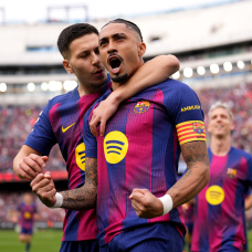 BARCELONA, SPAIN - MARCH 15: Raphinha of FC Barcelona celebrates scoring his team's first goal with teammate Roony Bardghji during the LaLiga EA Sports match between FC Barcelona and Sevilla FC at Spotify Camp Nou on March 15, 2026 in Barcelona, Spain. (Photo by Alex Caparros/Getty Images)