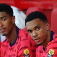 NOTTINGHAM, ENGLAND - JUNE 10: Jude Bellingham and Trent Alexander-Arnold of England look on, while sitting on the substitutes bench during the international friendly match between England and Senegal at City Ground on June 10, 2025 in Nottingham, England. (Photo by Carl Recine/Getty Images)
