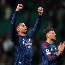 LISBON, PORTUGAL - APRIL 07: William Saliba of Arsenal celebrates after the team's victory in the UEFA Champions League 2025/26 Quarter-Final First Leg match between Sporting Clube de Portugal and Arsenal FC at Estadio Jose Alvalade on April 07, 2026 in Lisbon, Portugal. (Photo by Clive Brunskill/Getty Images)