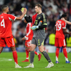 MADRID, SPAIN - APRIL 07: Manuel Neuer of FC Bayern Munich high fives teammate Jonathan Tah after the UEFA Champions League 2025/26 Quarter-Final First Leg match between Real Madrid CF and FC Bayern München at Estadio Santiago Bernabeu on April 07, 2026 in Madrid, Spain. (Photo by Angel Martinez/Getty Images)