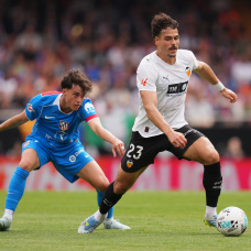 VALENCIA, SPAIN - MAY 02: Filip Ugrinic of Valencia CF is challenged by Javier Bonar of Atletico de Madrid during the LaLiga EA Sports match between Valencia CF and Atletico de Madrid at Estadi de Mestalla on May 02, 2026 in Valencia, Spain. (Photo by Alex Caparros/Getty Images)