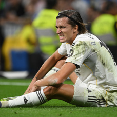 MADRID, SPAIN - AUGUST 30: Alvaro Carreras of Real Madrid
reacts after taking a knock during the LaLiga EA Sports match between Real Madrid CF and RCD Mallorca at Estadio Santiago Bernabeu on August 30, 2025 in Madrid, Spain. (Photo by Denis Doyle/Getty Images)
