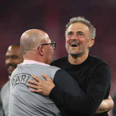 MUNICH, GERMANY - MAY 06: Luis Enrique, Head Coach of Paris Saint-Germain, celebrates with a member of coaching staff following their side's progression to the UEFA Champions League Final after the UEFA Champions League 2025/26 Semi Final Second Leg match between FC Bayern München and Paris Saint-Germain at Football Arena Munich on May 06, 2026 in Munich, Germany. (Photo by Alex Grimm/Getty Images)