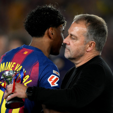 BARCELONA, SPAIN - MAY 10: Hansi Flick, Head Coach of FC Barcelona, embraces Lamine Yamal of FC Barcelona as they celebrate after defeating Real Madrid, and winning the LaLiga title, after the LaLiga EA Sports match between FC Barcelona and Real Madrid CF at Spotify Camp Nou on May 10, 2026 in Barcelona, Spain. (Photo by David Ramos/Getty Images)