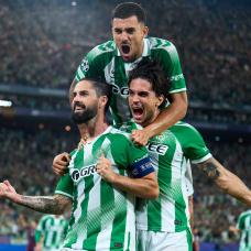 SEVILLE, SPAIN - OCTOBER 14: Isco of Real Betis celebrates after scoring his team's third goal with Marc Bartra and Dani Ceballos during the UEFA Champions League 2026/27 League Phase MD2 match between Real Betis Balompie and FC Porto at Estadio de La Cartuja on October 14, 2026 in Seville, Spain. (Photo by Angel Martinez/Getty Images)