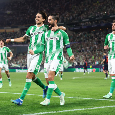 SEVILLE, SPAIN - OCTOBER 21: Isco of Real Betis Balompie celebrates scoring his team’s first goal with teammate Marc Bartra during the UEFA Champions League 2026/27 League Phase MD3 match between Real Betis Balompie and Feyenoord at Estadio de La Cartuja on October 21, 2026 in Seville, Spain. (Photo by Fran Santiago/Getty Images)