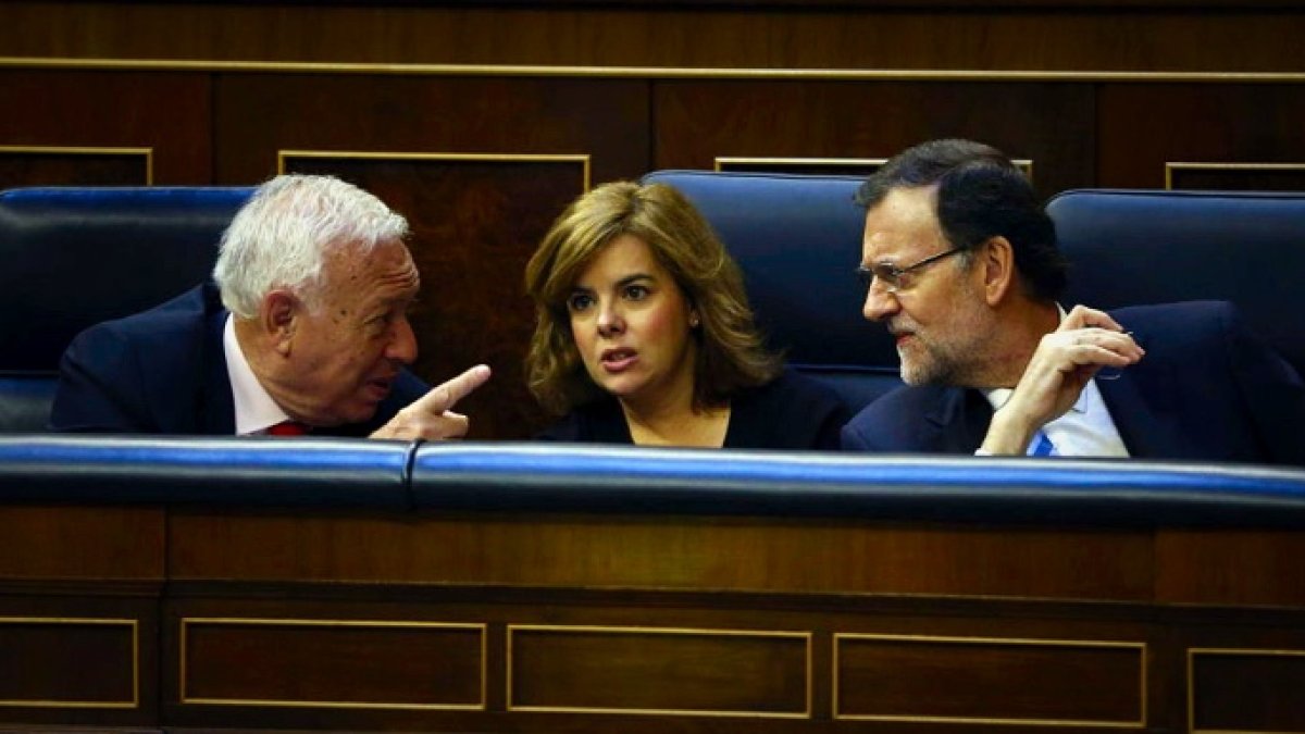 García Margallo, Soraya y Mariano Rajoy, durante un pleno en el Congreso.
