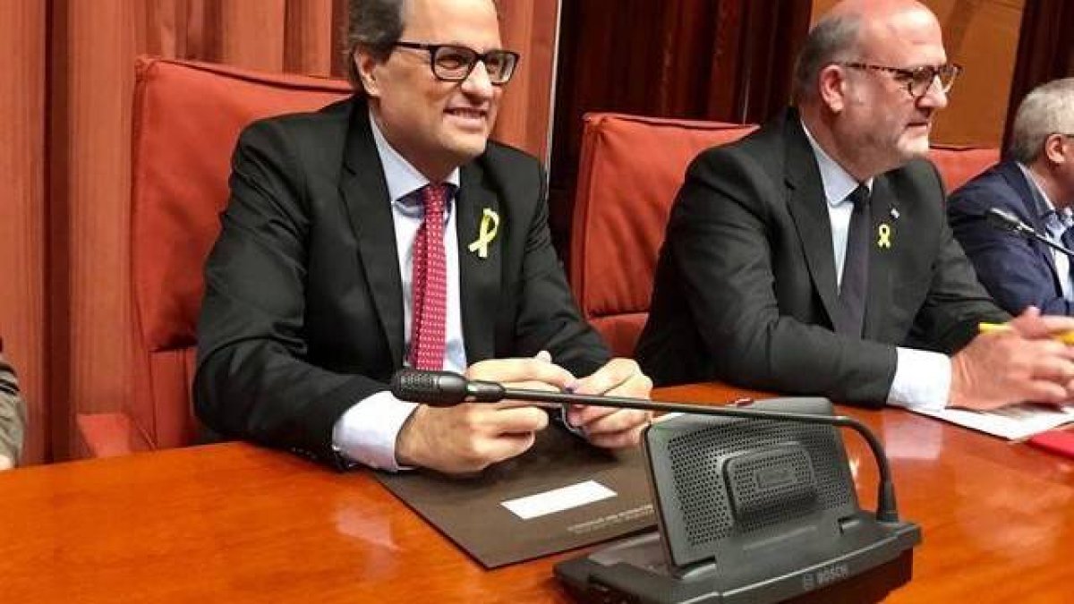 El presidente Torra junto al portavoz de JxCAT, Eduard Pujol