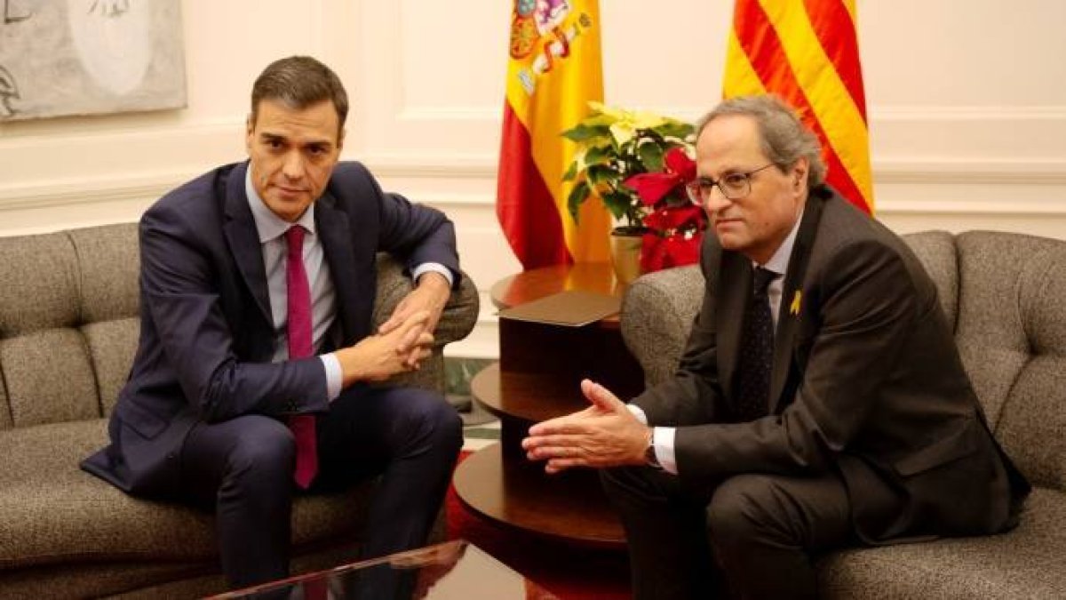 Sánchez y Torra, en una imagen típica de las