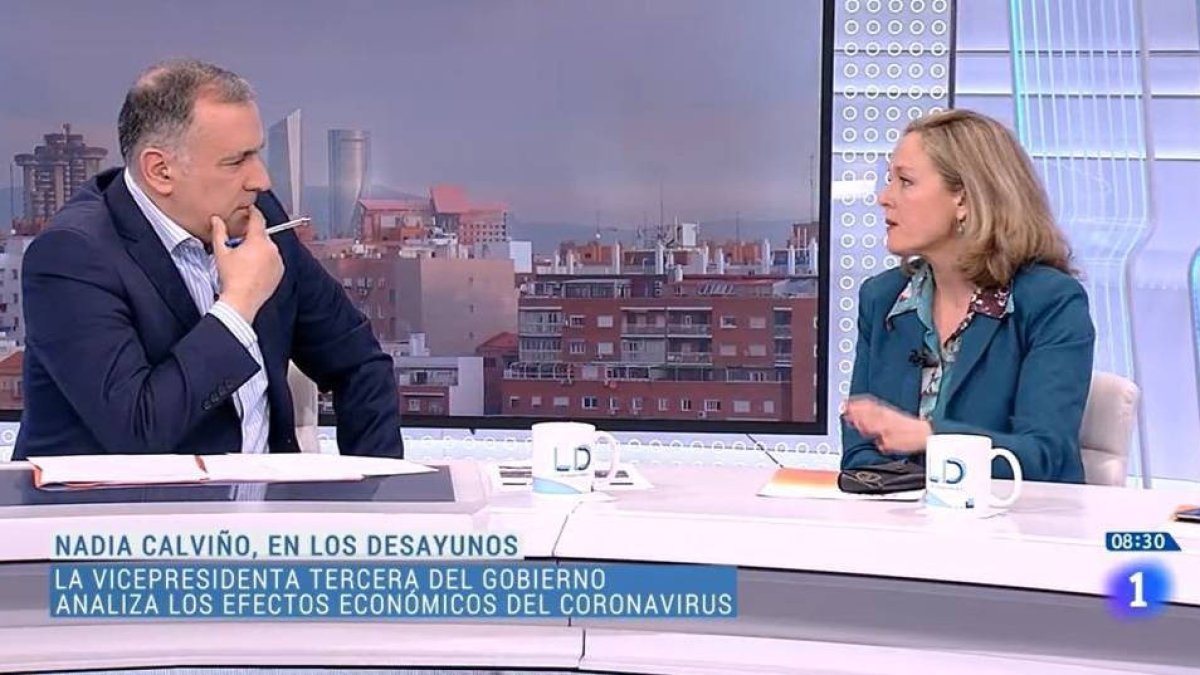 Xabier Fortes y Nadia Calviño en