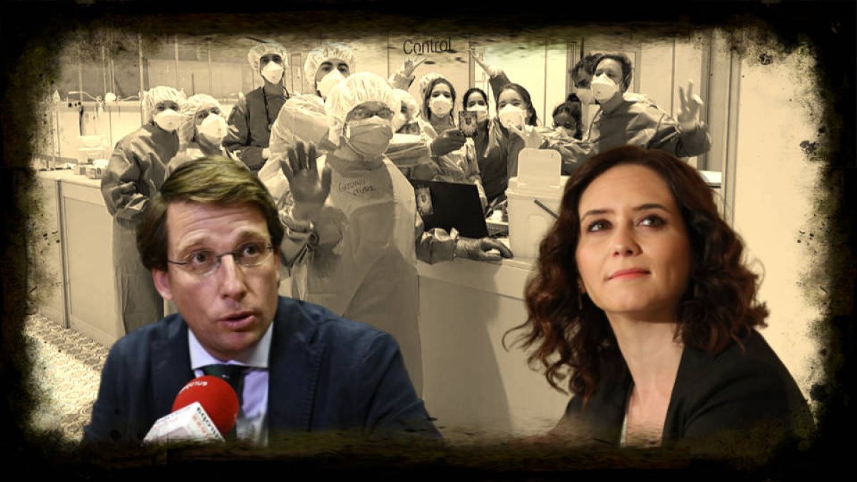 Ayuso y Almeida, entre sanitarios del hospital de campaña en IFEMA