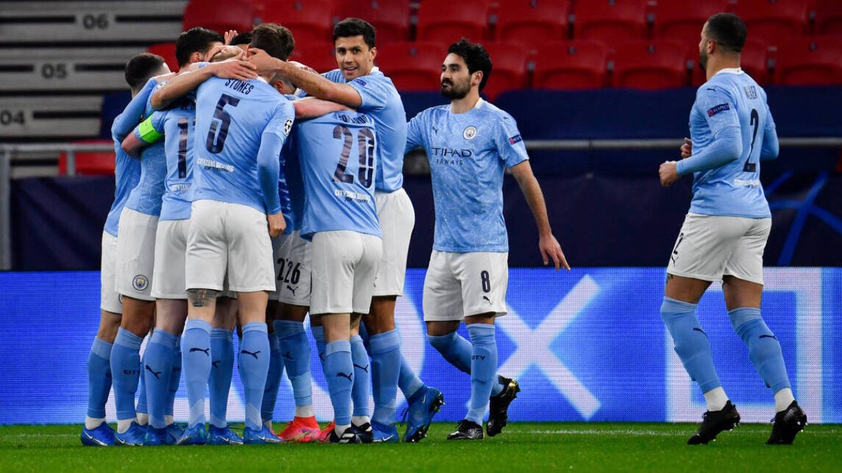 Los jugadores del Manchester City, celebrando un gol del equipo de Guardiola.