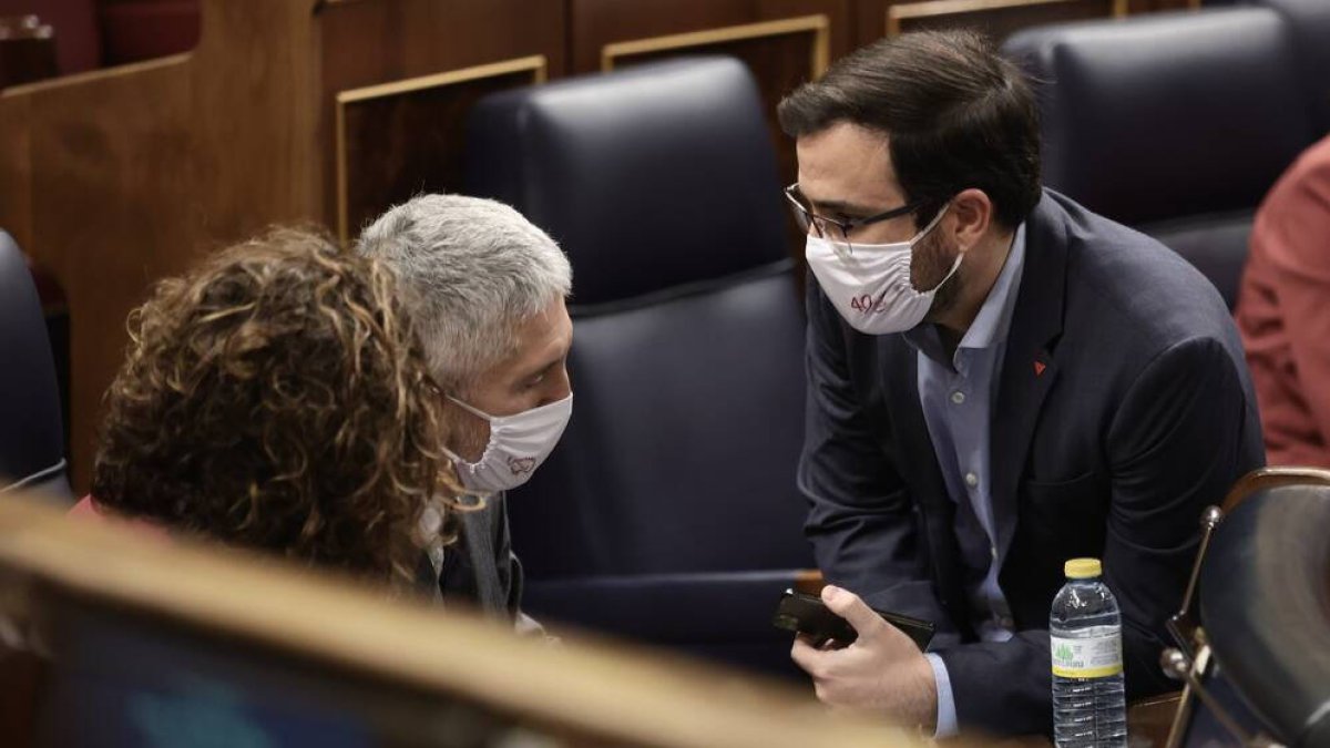 Alberto Garzón y Fernando Grande Marlaska