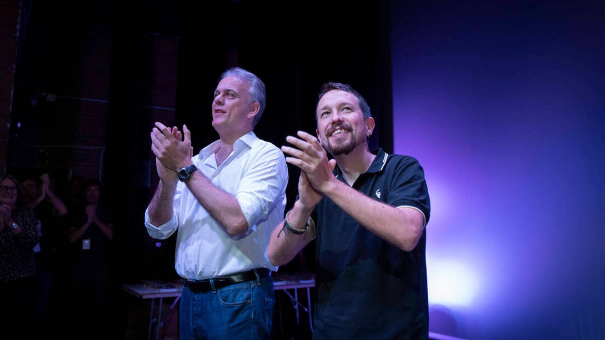 Héctor Illueca y Pablo Iglesias en su acto de Valencia
