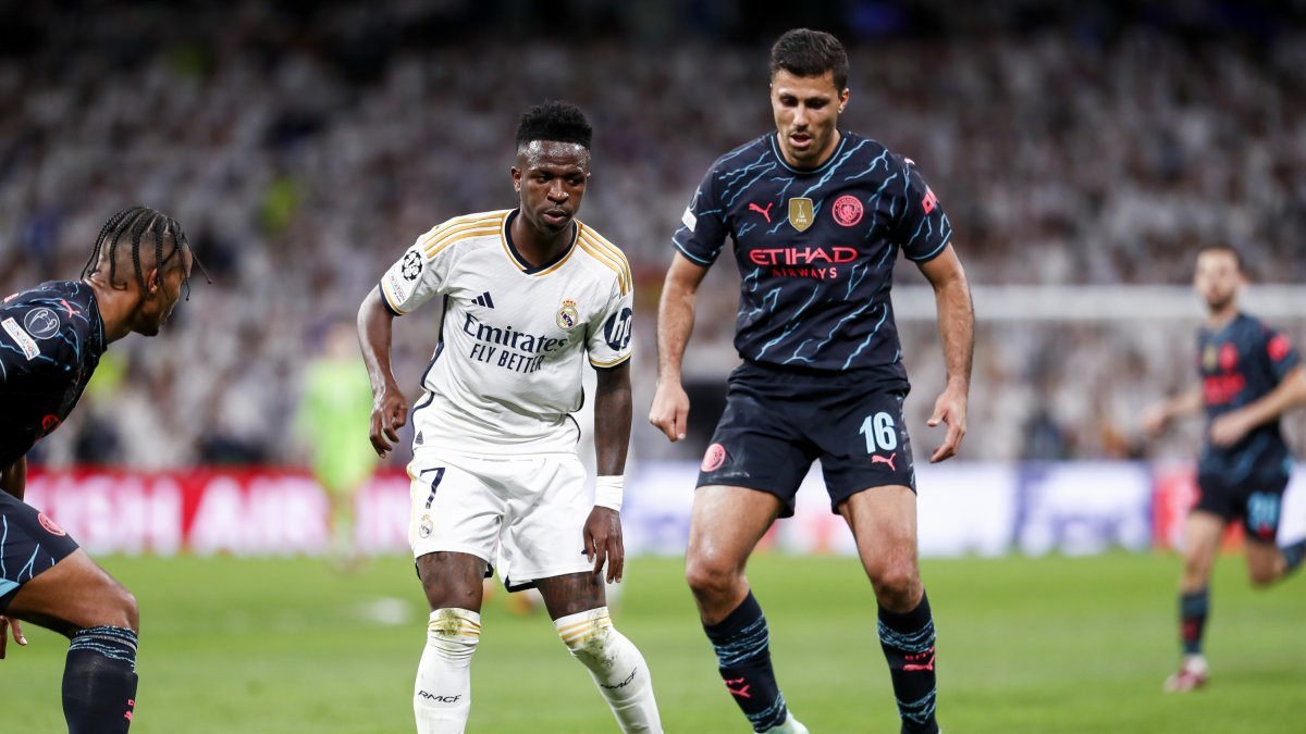 Vinicius y Rodri, durante un partido de Champions League.