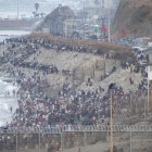 Decenas de migrantes intentan traspasar la frontera entre Ceuta y Marruecos, a 31 de julio de 2026.