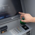 Archivo - Un hombre utiliza un cajero automático, a 26 de junio de 2024, en Madrid (España).