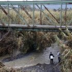 Búsqueda de las dos personas desaparecidas en Alhaurín el Grande (Málaga) tras el temporal.