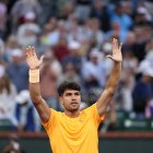 INDIAN WELLS, CALIFORNIA - MARCH 07: Carlos Alcaraz of Spain celebrates to the crowd after his straight sets victory against Grigor Dimitrov of Bulgaria in their second round match of the BNP Paribas Open at Indian Wells Tennis Garden on March 07, 2026 in Indian Wells, California. (Photo by Clive Brunskill/Getty Images)
