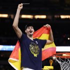 INDIANAPOLIS, INDIANA - APRIL 06: Aday Mara #15 of the Michigan Wolverines cuts down the net after defeating the UConn Huskies 69-63 in the National Championship of the 2026 NCAA Men's Basketball Tournament at Lucas Oil Stadium on April 06, 2026 in Indianapolis, Indiana. (Photo by Michael Reaves/Getty Images)