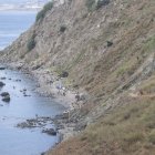 Inmigrantes acampados en playa del Sarchal, en Ceuta