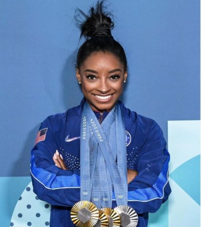 Simone Billes con sus medallas